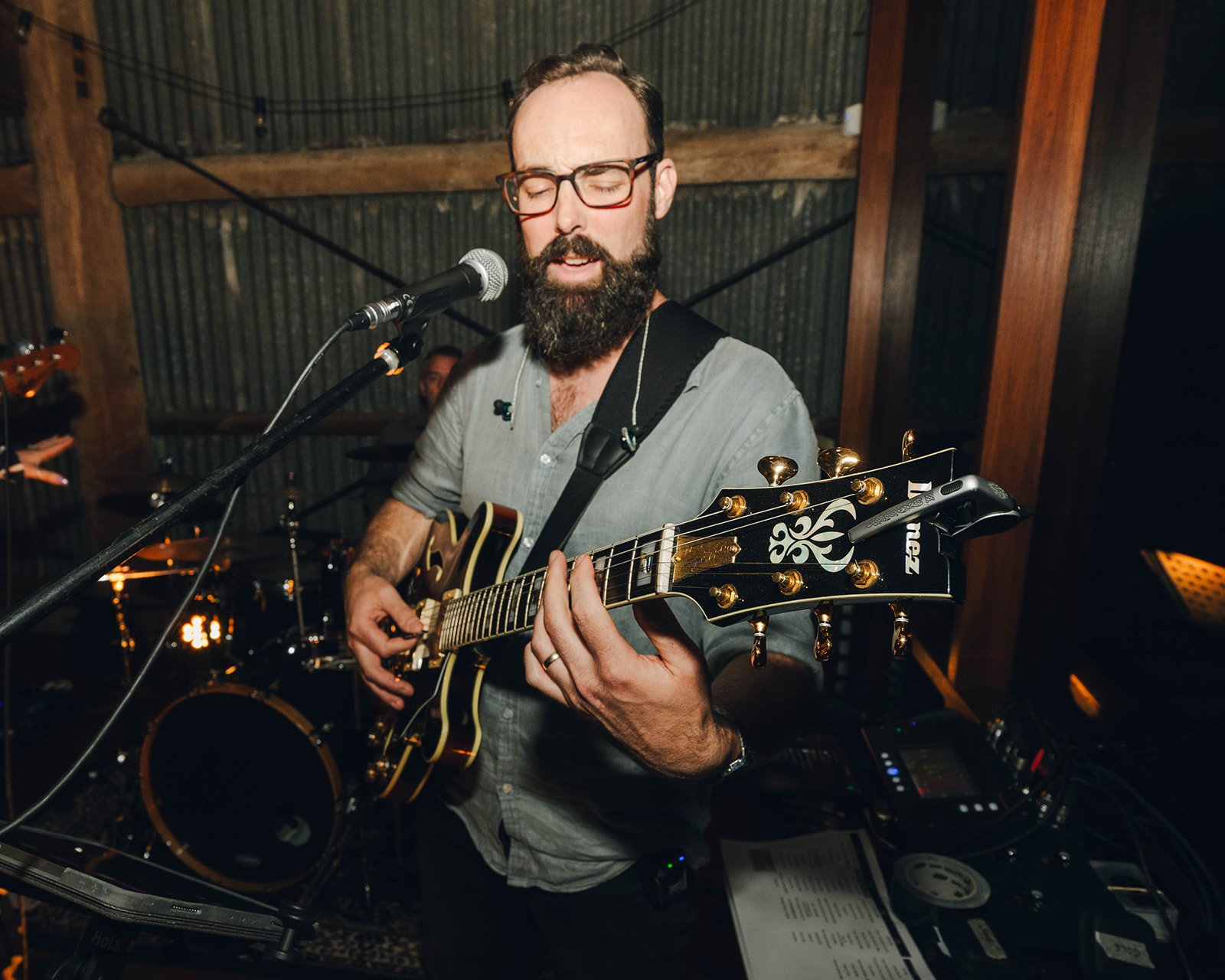 Jake playing an electric guitar during a live music performance for a wedding at Tocal Homestead in the Hunter Valley.