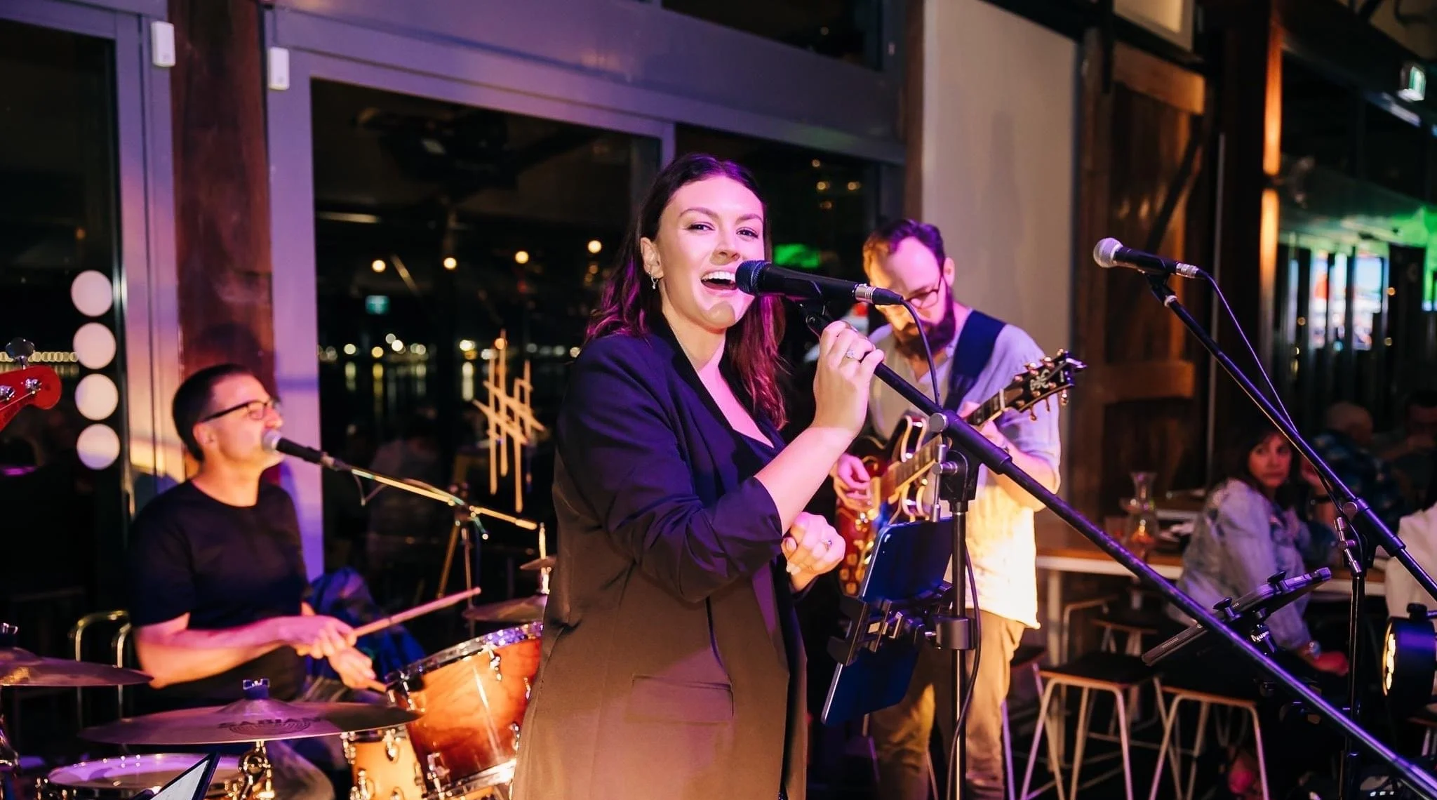 Aubrey wedding band performing live at Honeysuckle Hotel in Newcastle. India singing lead vocals, Jake on guitar and Cole on the drums.